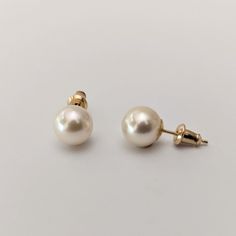 The minimalist earrings feature cultured saltwater Akoya pearls from Japan, elegantly set in 14K yellow gold studs, adding a touch of sophistication to your wardrobe. The pearls are 8.0-8.5mm in size, showcasing a round shape and a very good luster that enhances their appeal. Their light cream color beautifully contrasts with the warm tones of the yellow gold, creating an appealing aesthetic. The pearls' clean surface contributes to their elegance and overall beauty. These earrings are a perfect Classic Hypoallergenic Yellow Gold Pearl Earrings, Classic Akoya Pearl Earrings, Classic Hypoallergenic 14k Gold Pearl Earrings, Classic Yellow Gold Pearl Earrings, Hypoallergenic Akoya Pearl Earrings In Classic Style, Classic Hypoallergenic Akoya Pearl Earrings, Hypoallergenic Classic Akoya Pearl Earrings, Minimalist Akoya Pearl Earrings In Yellow Gold, Minimalist Yellow Gold Akoya Pearl Earrings