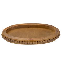 an oval wooden tray with beaded edges