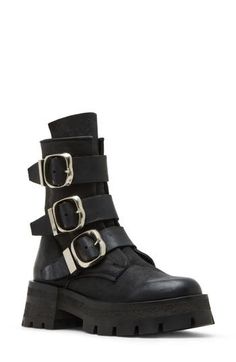 Bring a bit of moto edge to your everyday style in this lug-sole bootie accented with a trio of bold buckle straps. 2 1/4" heel 6 3/4" shaft Side zip closure Leather upper/synthetic lining and sole Imported Edgy Platform Boots With Buckle Closure And Round Toe, Edgy Heeled Boots With Buckle Closure And Round Toe, Ankle-high Platform Boots With Buckle Punk Style, Ankle-high Platform Boots With Buckle Closure Punk Style, Punk Style Leather Heeled Boots With Buckle Closure, Edgy Ankle Moto Boots With Reinforced Heel, Edgy Boots With Metal Pin Buckle For Fall, Edgy Leather Boots With Metal Pin Buckle, Edgy Fall Boots With Metal Pin Buckle