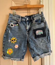 Boho|Hippie upcycled denim. Each pair of jeans/ jean shorts  are unique, they will have simplistic imperfections and fraying to enhance the vintage vibe. Created with original handmade patches by me and purchased patches.  Send me your jeans($20 discount), and we can work together to create a pair to match your style!  This creation: Gap Bermuda Shorts with 9" inseam:  size 4(27). Upcycled Blue Jeans For Summer, Patchwork Cotton Jean Shorts For Spring, Blue Upcycled Jeans For Summer, Jeans Patchwork Diy, Light Wash Recycled Denim Shorts For Spring, Retro Denim Jean Shorts For Spring, Upcycled Denim Bottoms For Summer, Denim Blue Patchwork Jean Shorts For Spring, Upcycled Denim Jeans For Summer