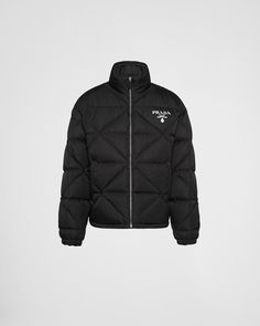 Black Re-nylon Down Jacket | PRADA Designer Black Nylon Outerwear, Luxury Nylon Outerwear For Streetwear, Classic Black Outerwear With Zip Cuffs, Luxury Long Sleeve Puffer Jacket For Outdoor, Luxury Long Sleeve Outdoor Outerwear, Classic Nylon Outerwear With Padded Collar, Luxury Nylon Outerwear For Outdoor, Designer Puffer Outdoor Outerwear, Designer Puffer Outerwear For Outdoor