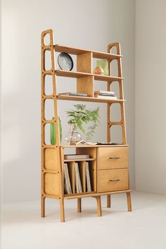 a wooden shelf with books and magazines on it