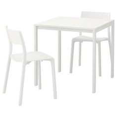 a white table and two chairs sitting next to each other