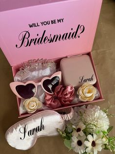 the bridesmaid box is filled with wedding accessories