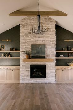 a living room filled with furniture and a fire place in the middle of a room