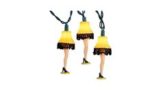 two yellow lamps with black tassels and one has a pair of high heeled shoes