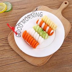 sliced up vegetables on a white plate with the words good morning written in black lettering