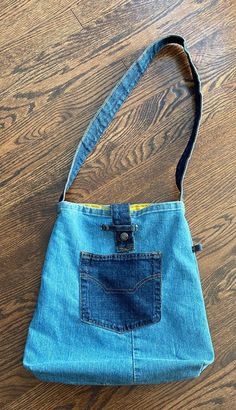 a blue purse sitting on top of a wooden floor