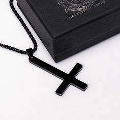 "Experience the allure and power of our gothic-inspired upside down cross necklace, crafted with sturdy black alloy steel. This must-have accessory comes with a sleek 20-inch double-linked black chain, ensuring longevity and offering incredible value. Don't miss out on this one-of-a-kind piece!" Gothic Stainless Steel Cross Pendant Jewelry, Gothic Black Crucifix Cross Necklace, Minimalist Black Cross Jewelry, Black Stainless Steel Crucifix Necklace, Adjustable Black Cross Jewelry, Minimalist Black Cross Pendant Jewelry, Black Cross Necklace As Gift, Black Stainless Steel Necklace With Cross Pendant, Black Stainless Steel Cross Pendant Necklace