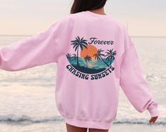 Forever Chasing Sunsets Sweatshirt or Hoodie Two Side Printed, Retro Beach Sweater, Tropical Tee, Retro Summer Sweatshirt, Aesthetic Summer This shirt has a hand pressed design. It has a very soft touch that you will feel comfortable for a long day. HOW TO ORDER ** Check and Review all Photos. ** Select your item's Size and Color from drop down menus. ** Choose the Quantity you want. ** Provide personalization in personalization box if offered.(name, print color etc.) ** Click ADD TO CART. And, Summer Long Sleeve Leisure Sweatshirt, Long Sleeve Summer Leisure Sweatshirt, Vsco Crew Neck Sweatshirt For Summer, Vsco Style Crew Neck Sweatshirt For Summer, Summer Vacation Hoodie With Crew Neck, Beach Season Streetwear Sweatshirt Crew Neck, Vsco Graphic Print Sweatshirt For Beach Season, Beach Season Graphic Print Long Sleeve Sweatshirt, Summer Letter Print Hoodie With Crew Neck