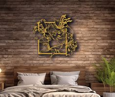 a bedroom with brick walls and a wooden headboard that has an abstract design on it