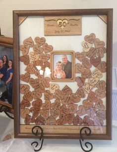 a family photo frame with hearts attached to it