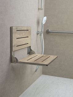 a shower with a wooden seat attached to the wall