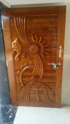 a wooden door with intricate carvings on it