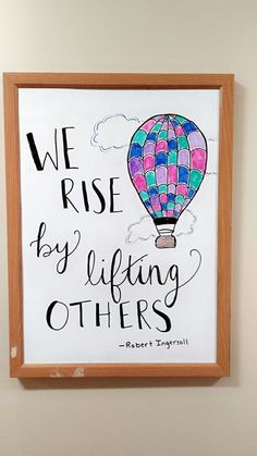 we rise by lifting others up to the sky with a hot air balloon painted on it