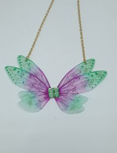 Discover the new magnificent collection of resin fairy wing necklaces. They have been created with love to add a magical and magical touch to your day! *The fairy wing necklace was created by me in my magical workshop. The necklace has a stainless steel chain adjustable by an extension chain. These high-end jewelry pieces are both elegant and durable. *The magical and magical fairy wings are made from resin which is a delicate but sturdy material once hardens. A certain light and shine has been Magical Workshop, Glittery Butterfly, Butterfly Fairy Wings, Magical Fairy, Butterfly Fairy, Wing Necklace, Pendant For Women, Fairy Wings, The Fairy