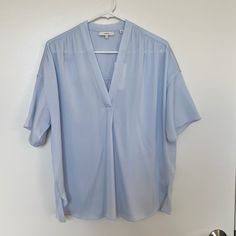 Never Worn, New With Tags. Runs Large Pale Icy/Powder Blue. Hard To Capture In Photos, The Color Is In Between The Photos Of The Item And The Stock Photos Oversized Fit Drapes Beautifully Slips On Drop Shoulders Elbow-Length Sleeves Curved Hem 92% Silk, 8% Elastane (Feels Amazing!) The Shirred V-Neck Blouse Is Done In A Matte Silk Blend With A Clean-Finished Neckline And Delicate Gathering Along The Shoulders And Back Yoke. Satin Wrap Blouse, Band Collar Blouse, Black Flannel, Loose Fit Blouse, Black Blouse Long Sleeve, Velvet Blouses, High Neck Sleeveless, Plaid Blouse, Flowy Blouse