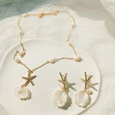 This starfish necklace is easy to match with any outfits, and is perfect for the beach! It reminds you the warm breeze by the ocean, and makes you feels the sea wave around your ear. They are perfect for any summer day, a gift for a beach wedding, or just a fun reminder of the sea.  The matching earrings link: https://www.etsy.com/listing/1427407033/gold-starfish-earringssea-shell-pearl Measurement: 16" long and each necklace comes with a 2" extension chain. You can wear anywhere from 16" to 19",  If you need a different length, or prefer to not have an extension chain, please message me 😊 💕Thank you for visiting CaitlynArtStudio. We are always trying to provide you the best quality jewelry at an affordable price. Made with lots of love and care. Please feel free to contact me with Custo Necklace Gold Jewelry, Gold Schmuck, Beach Necklace, Sea Wave, Jewelry Summer, Beach Necklaces, Starfish Necklace, Sea Shell, Pearl Pendant