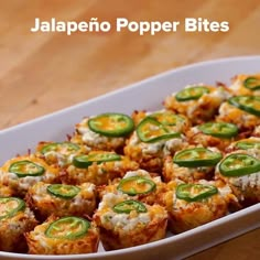 jalapeno popper bites in a casserole dish on a wooden table