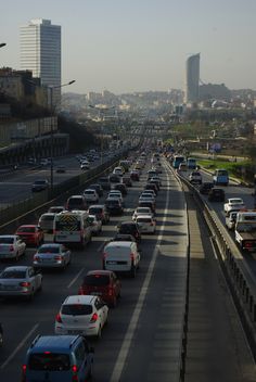 many cars are driving down the highway in both directions