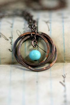 Copper Ring Necklace with Vintage Baby Blue by monkeysalwayslook, $38.00 Hand Forged Vintage Jewelry, Vintage Hand Forged Round Jewelry, Bronze Wire Wrapped Round Jewelry, Artisan Metal Jewelry With Patina, Rustic Nickel-free Round Bead Jewelry, Rustic Bronze Electroformed Jewelry, Rustic Bronze Nickel-free Jewelry, Artisan Soldered Round Beads Jewelry, Nickel Free Copper Jewelry With Round Beads