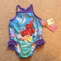 Brand - Disney Princess. The Little Mermaid One Piece Swimsuit. Brand New! Nwt! Baby Girl 12 Months. Smoke Free Home. $8 Is Final Price Unless You Bundle And Receive Additional Discount. Blue Cartoon Print Swimwear For Play, Cute Character Print Swimwear For Playwear, Cute Character Print Swimwear For Play, Cute Swimwear With Character Print For Playwear, Fitted Character Print Onesie For Playwear, Fitted Swimwear With Character Print For Swimming, Fitted Onesie With Character Print For Playwear, Cute Character Print Swimwear For Playtime, Fitted Cartoon Print Swimwear For Swimming