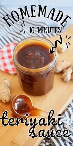 homemade teriyaki sauce in a jar on a wooden cutting board with ginger flakes