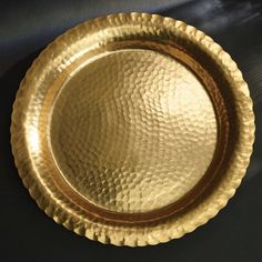 a gold plate sitting on top of a table