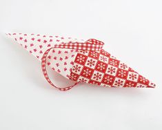 a red and white origami christmas cone