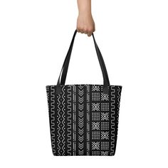 Inspired by the designs of the traditional Malian cotton fabrics, this beautiful African mud cloth tote bag design will become a trend setter among your friends. A spacious and trendy tote bag to help you carry around everything that matters. • Made to order • African Mud Cloth design is digital printed on fabric • 100% spun polyester fabric • Bag size: 15″ × 15″ (38.1 × 38.1 cm) • Capacity: 2.6 US gal (10 l) • Maximum weight limit: 44lbs (20 kg) • Dual handles made from 100% natural cotton bull Cloth Tote Bag, Tote Outfit, Cloth Design, Trendy Tote Bags, African Mud Cloth, Trendy Tote, Mud Cloth, Fabric Bag, Bag Design