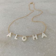 "dainty luminous mother of pearl letters spell out A L O H A linked on this  16\" 14k gold-filled chain necklace" Pearl Layering, Pearl Letters, Long Pearl Necklaces, Layering Necklace, Sapphire Earrings, Beaded Necklaces, Minimalist Necklace, Gold Filled Chain, Honolulu