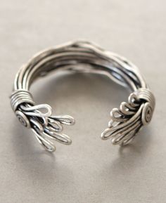 a close up of a silver ring on a table