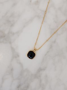 A symbol of strength and clarity, the black onyx in the "Nocturne" Square Necklace carries with it a quiet power. Known for its grounding properties, this natural stone offers protection and emotional resilience, while the 18k Gold Vermeil over sterling silver enhances its allure with a soft, golden glow. In its geometric simplicity, the square charm represents balance and stability, a perfect harmony between elegance and meaning. Materials: Natural black onyx, framed in 18k Gold Vermeil over st Gold Obsidian Jewelry As A Gift, Gold Onyx Gemstone Necklace, Black Spinel Gemstone Necklace For Gift, Gold Spiritual Obsidian Jewelry, Everyday Gold Onyx Jewelry, Everyday Onyx Gemstone Jewelry, Black Onyx Jewelry For Meditation, Black Spinel Gemstone Necklace, Black Onyx Jewelry For Healing