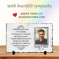 a memorial plaque with an image of a smiling man and the words, with heart - felt sympathy order today at budderstown com