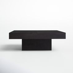 a black table sitting on top of a white floor