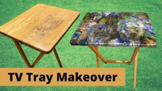 two wooden tables sitting next to each other on top of a green grass covered field