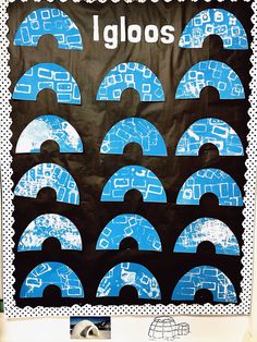 an art project with blue and white designs on black paper that says igloos