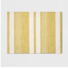 a yellow and white striped placemat