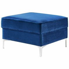 a blue footstool sitting on top of a white floor