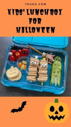 kids'lunchbox for halloween is packed with sandwiches, crackers, and candy