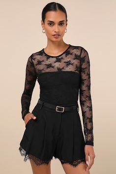 A date night spent in the Lulus Sheer-ly Sweet Black Sheer Lace Crew Neck Long Sleeve Bodysuit is bound to be a total treat! Sheer floral lace shapes this flirty bodysuit with a crew neckline and sheer dÃ©colletage that flows into long fitted sleeves. The figure-hugging bodice finishes at attached thong bottoms with snap closures. Fit: This garment fits true to size. Length: Size medium measures 29.50" from shoulder to hem. Bust: Great for any cup size. Waist: Fitted - stretchy fabric allows cus Black Lace Tops For Party, Black Lace Party Tops, Sheer Lace Bodysuit For Night Out, Fitted Lace Flirty Top, Elegant Long Sleeve Lace Bodysuit, Black Lace Closure Bodysuit For Party, Fitted Flirty Lace Top, Black Party Bodysuit With Lace Closure, Feminine Fitted Bodysuit With Lace Closure