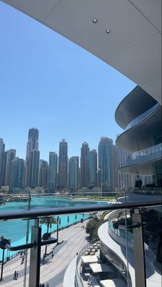 a balcony overlooking the water and city skyline