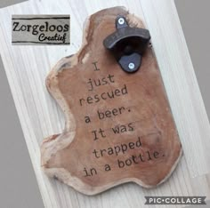 a piece of wood that has writing on it and a bottle opener attached to it