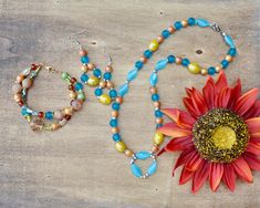 Beautiful boho beaded artisan handmade carnelian jewelry gift set for her.  This set is a beautiful blend of sparkly soft bronze druzy beads, gorgeous carnelian beads, ceramic yellow barrel beads, blue czech glass beads in different shapes.  Soft caramel colored ceramic beads and gold/silver hematite spacers.  Such a unique blend of colors.  The bracelet has gold and the necklace/earrings have silver.  Love the blends of textures and colors on these.  Everything in my store is nickel free.  If y Artisan Jewelry With Spacer Beads For Gifts, Artisan Spacer Beads Jewelry As Gift, Bohemian Polished Beads For Gifts, Artisan Gemstone Beads For Gifts, Artisan Beaded Necklaces With Spacer Beads As Gift, Artisan Jewelry With Faceted Beads For Gifts, Artisan Jewelry With Faceted Beads As A Gift, Bohemian Faceted Beads For Crafting, Amber Beaded Necklaces With Spacer Beads As Gift