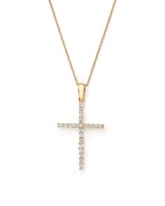 A diamond cross pendant suspends from a sleek 14K yellow gold chain from our exclusive collection. Yellow Gold Diamond Cross Pendant Necklace, Yellow Gold Cross Pendant Necklace With Brilliant Cut, Yellow Gold Cross Pendant Necklace With Diamond Accents, Yellow Gold Pendant Cross Necklace With Diamond Accents, Elegant Yellow Gold Diamond Necklace With Cross Pendant, Yellow Gold Diamond Cross Necklace, Yellow Gold Cross Necklace With Diamond Accents, Elegant Yellow Gold Diamond Cross Pendant Necklace, Elegant Yellow Gold Cross Pendant Diamond Necklace