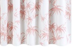 a pink and white curtain with bamboo leaves on it