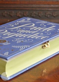 a blue book sitting on top of a wooden table