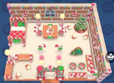 an overhead view of a gingerbread house decorated with candy canes and candies