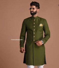 "Give yourself a best ethnic look by wearing this Indian Sherwani Made of Rich blend fabric this regular-fit set comprises a full-sleeved Indian Sherwani kurta with Pajama. This outfit with mojris will look apart on special occasions like in Wedding, Parties, Engagement, Family Functuons, etc. Metarial : Cotton fabric, Handmade Buttons. Color : Green Sleeves : Long Pockets : Available Left Hand Stitcheded Mashallah in Red Color is Optional, Buyer can Contact me if they want it or Not. Sherwani k Green Fitted Kurta With Naqshi, Bollywood Style Sherwani With Long Sleeves, Green Bandhgala With Naqshi For Festivals, Ceremonial Cotton Bandhgala For Transitional Season, Green Long Sleeve Bandhgala With Naqshi, Ceremonial Cotton Sherwani With Cutdana, Green Ceremonial Kurta For Transitional Season, Formal Cotton Sherwani For Festivals, Transitional Green Kurta For Ceremonial Occasions