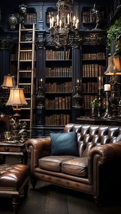 a leather couch and chair in front of a book shelf with many books on it